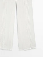 Pantalon avec broderies en coton mélangé