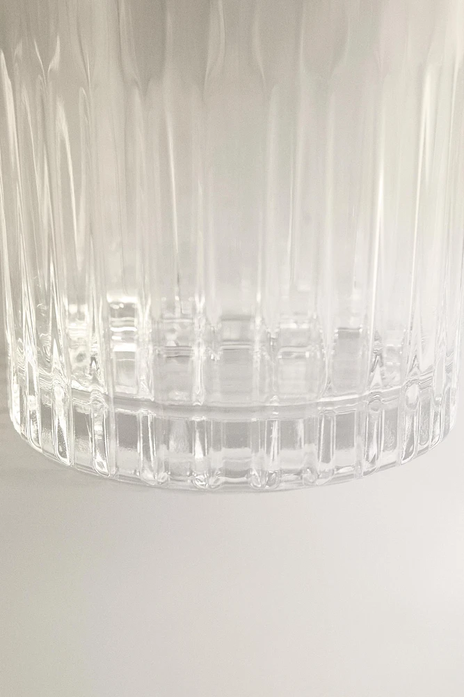 CRYSTALLINE TUMBLER WITH RAISED DESIGN