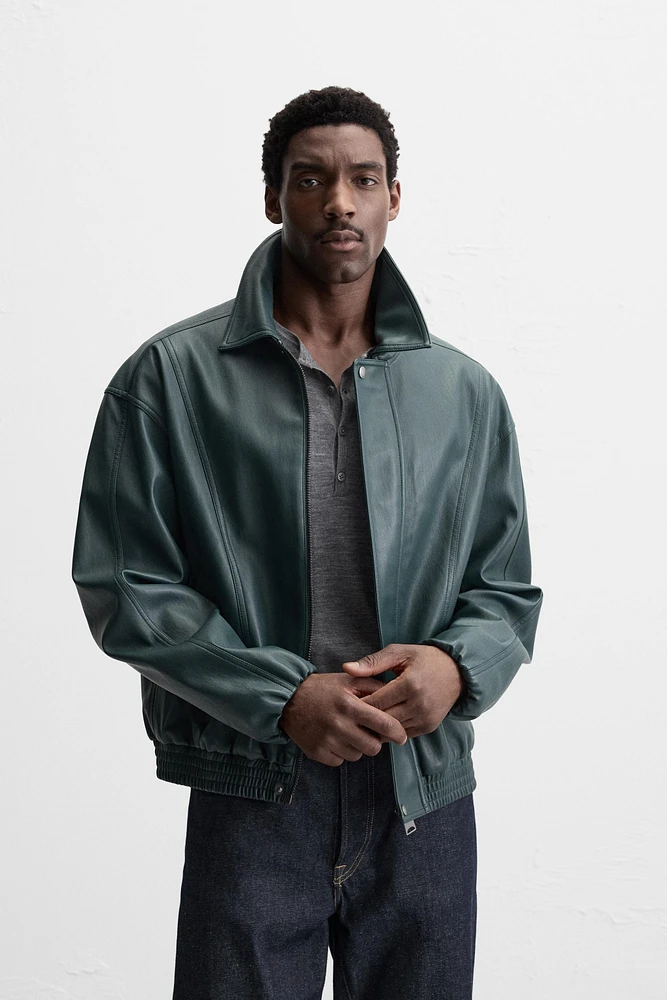 BLOUSON EN MATIÈRE SYNTHÉTIQUE