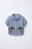 POLO EN MAILLE À FLEURS CROCHET
