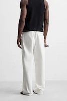 RELAXED FIT PLEATED PANTS