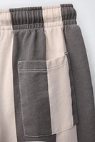 PANTALON EN MATIÈRES VARIÉES À RAYURES