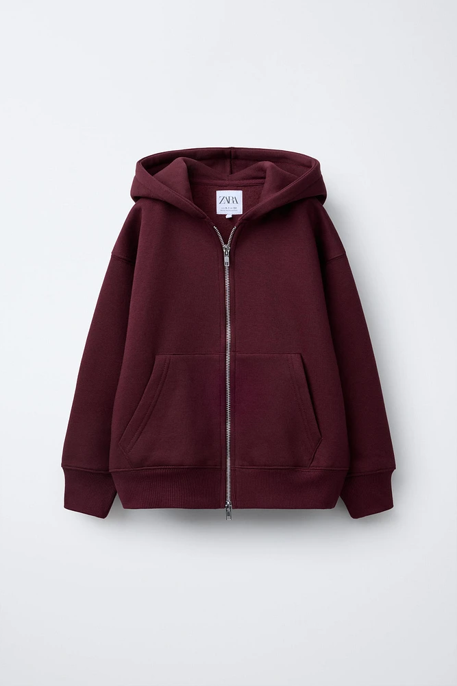 SWEAT À CAPUCHE ET ZIP