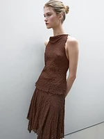 Flowing check skirt with asymmetric hem