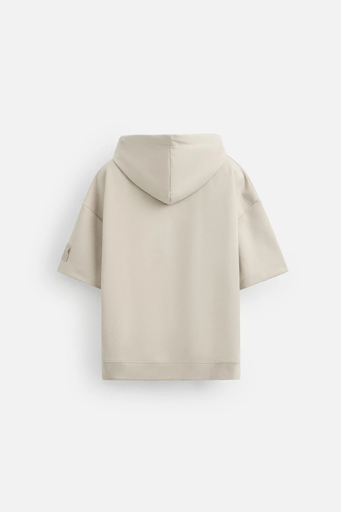 SWEAT TECHNIQUE À CAPUCHE