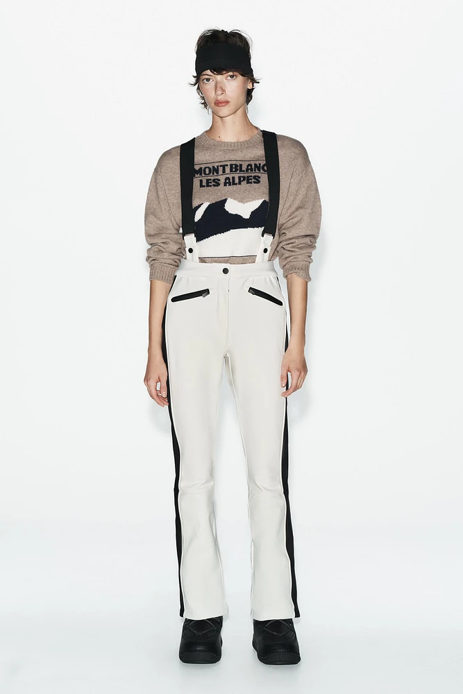 PANTALON ÉVASÉ AVEC TISSU RÉSISTANT À L'EAU
ET COUPE-VENT TECHNOLOGIE RECCO® COLLECTION SKI