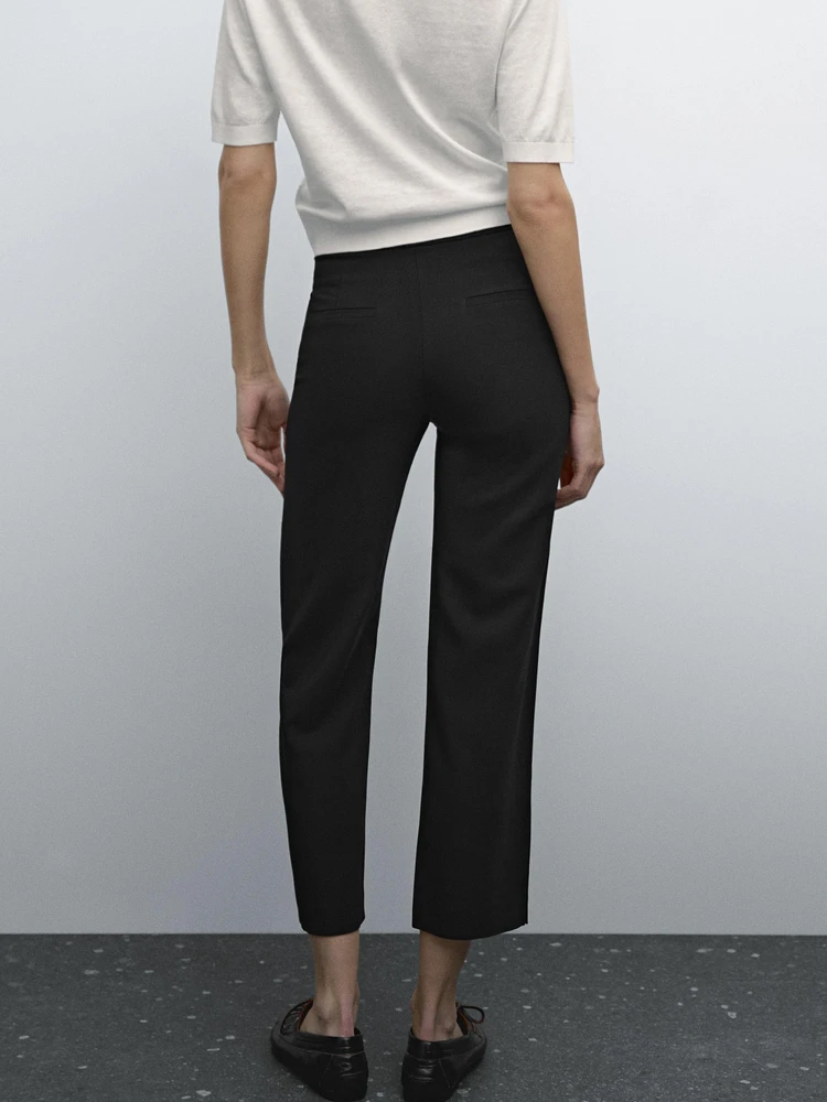 Pantalon avec boutons dans le bas