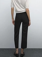 Pantalon avec boutons dans le bas