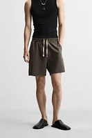 BERMUDA RELAXED FIT DÉLAVÉ