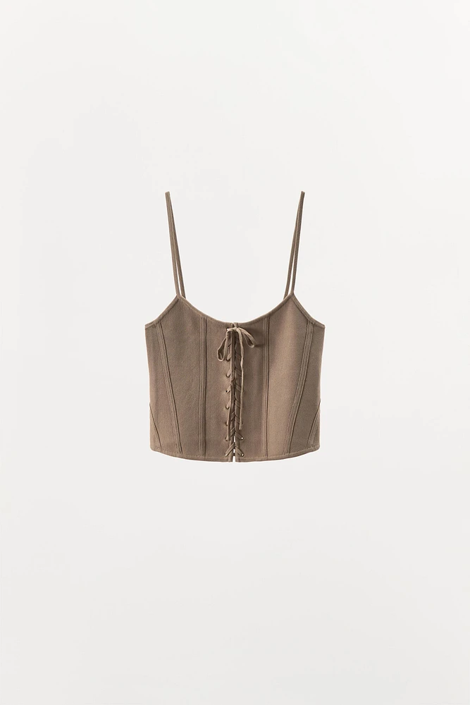 CORSET EN MAILLE À LACETS