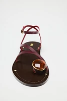 FLAT LEATHER SANDALS WITH DECORATIVE STRAPS