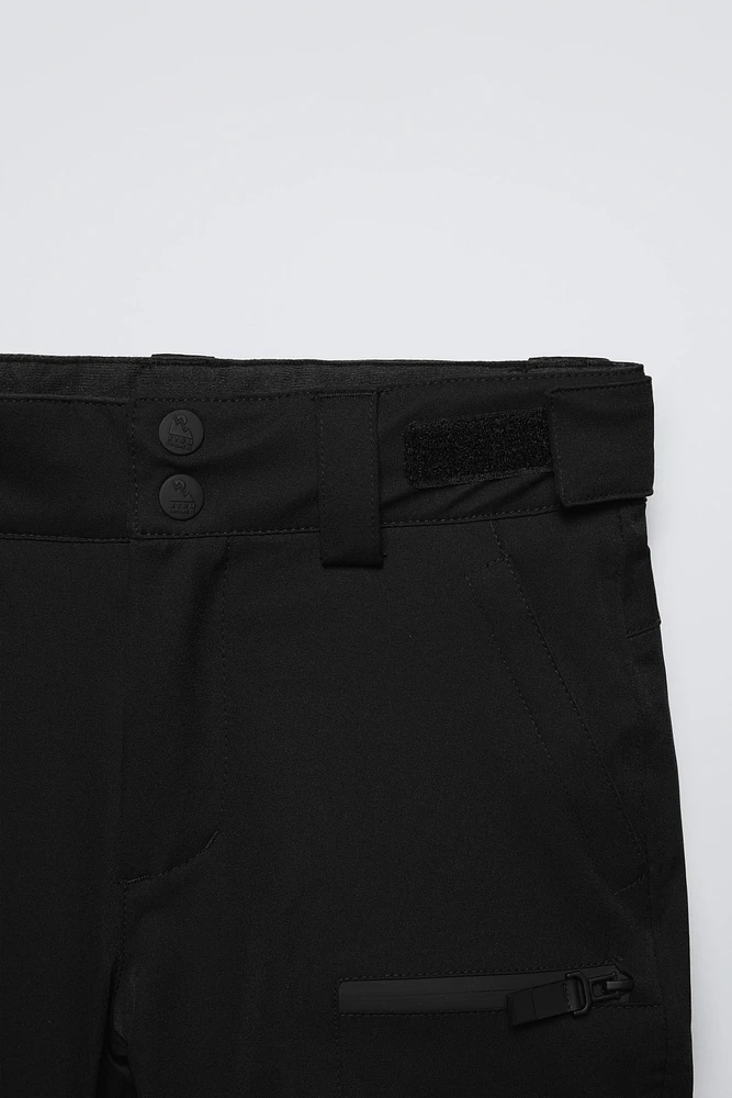 PANTALON COUPE-VENT ET DÉPERLANT RECCO® SYSTEM SKI COLLECTION