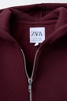 SWEAT À CAPUCHE ET ZIP