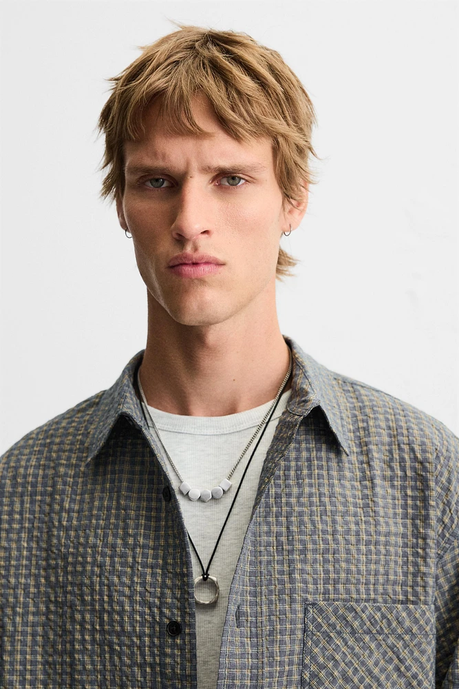 CHEMISE À CARREAUX AVEC POCHE