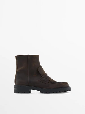 Track sole ankle boots with penny strap