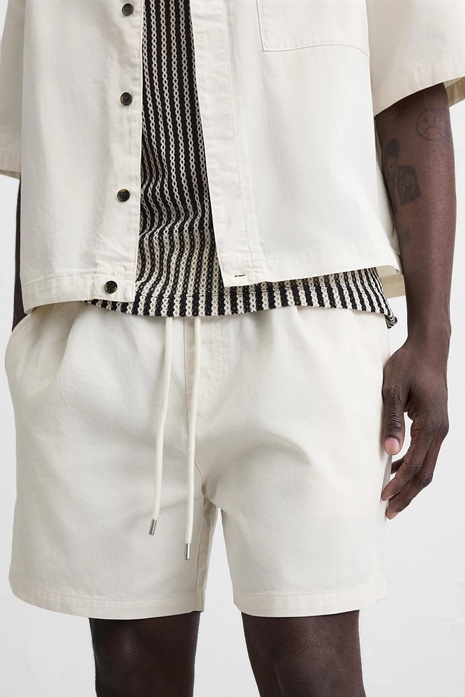 BERMUDA RELAXED FIT DÉLAVÉ