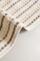 TEXTURED POLKA DOT BATH TOWEL