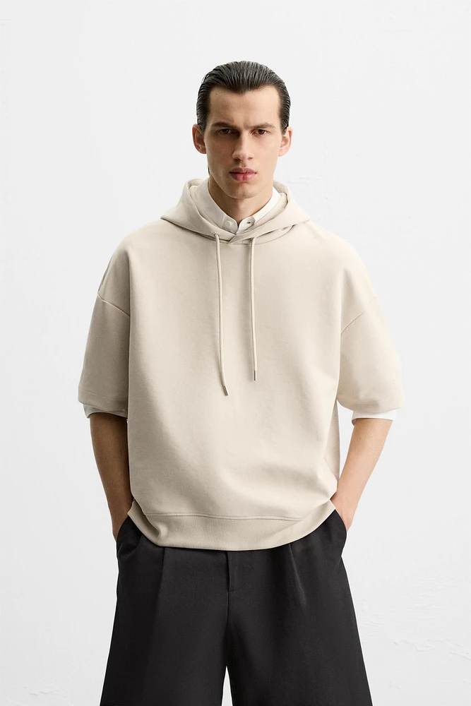 SWEAT TECHNIQUE À CAPUCHE