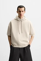 SWEAT TECHNIQUE À CAPUCHE