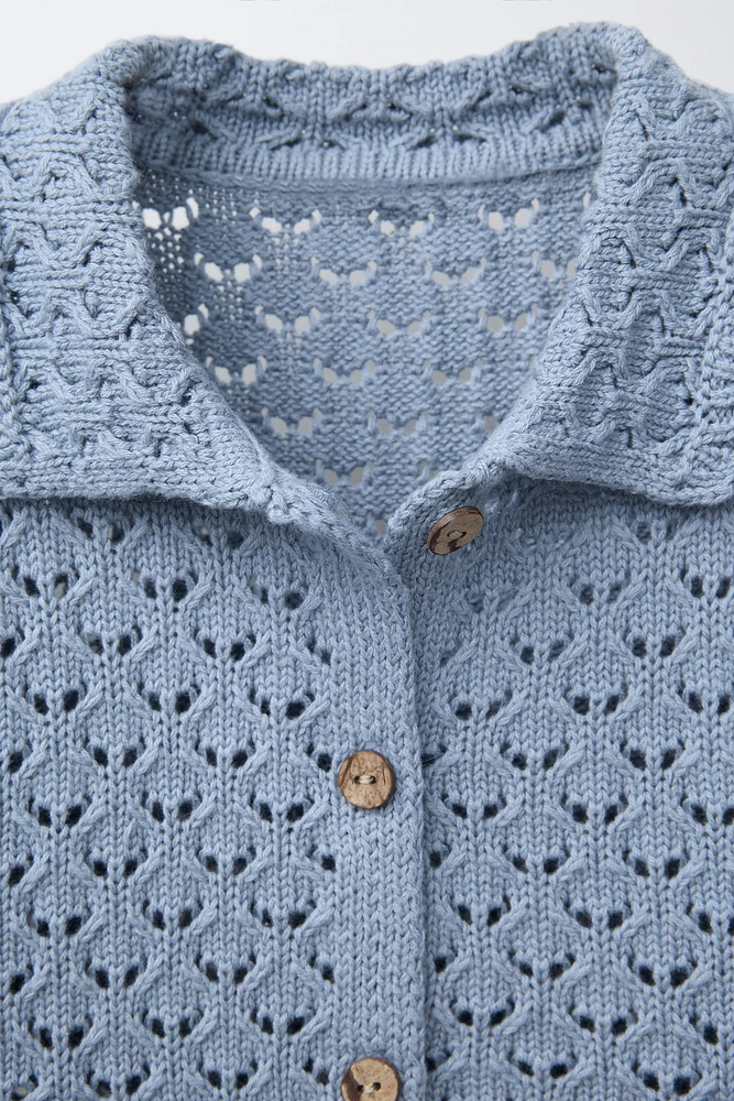 POLO EN MAILLE À FLEURS CROCHET