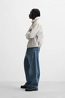 VESTE EN JEAN AVEC COL MATIÈRES VARIÉES