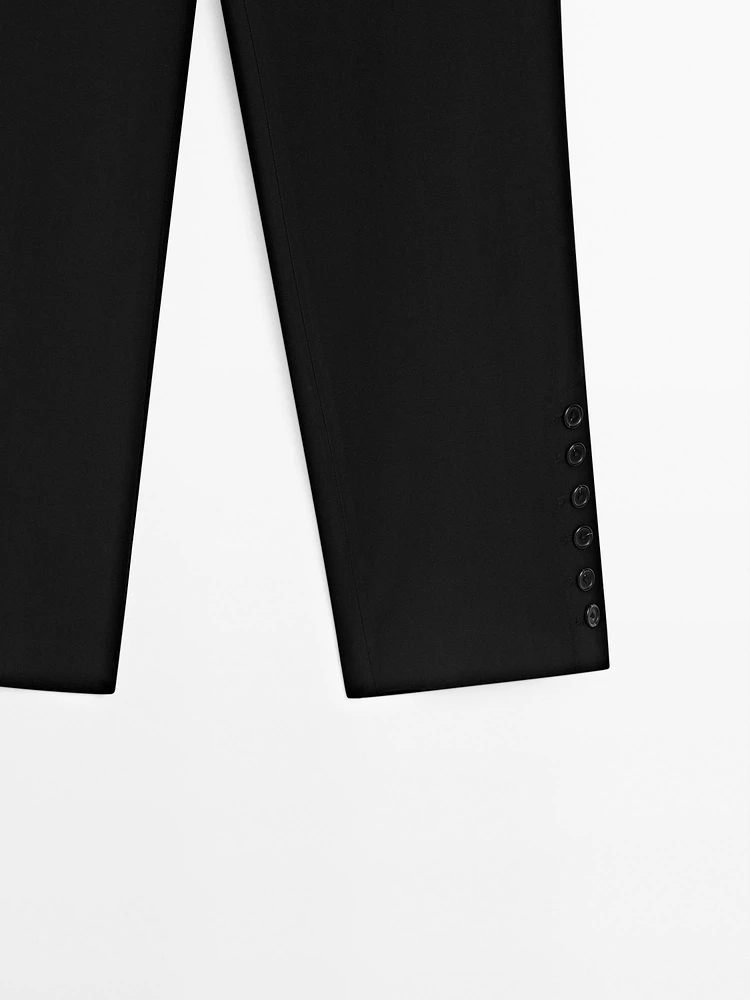 Pantalon avec boutons dans le bas