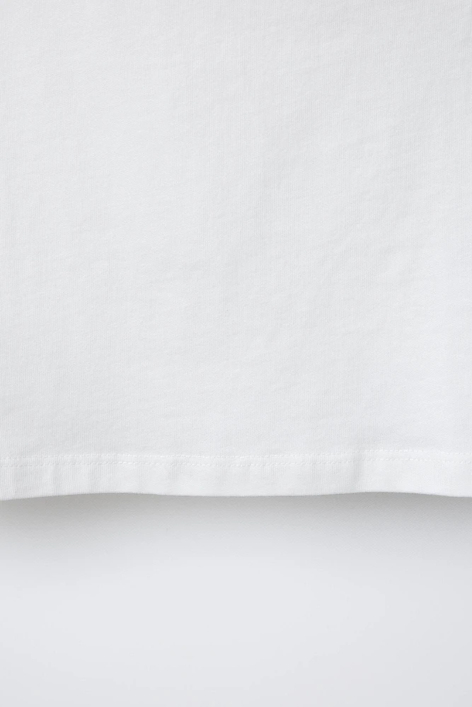 HAUT ASYMÉTRIQUE À ŒILLETS