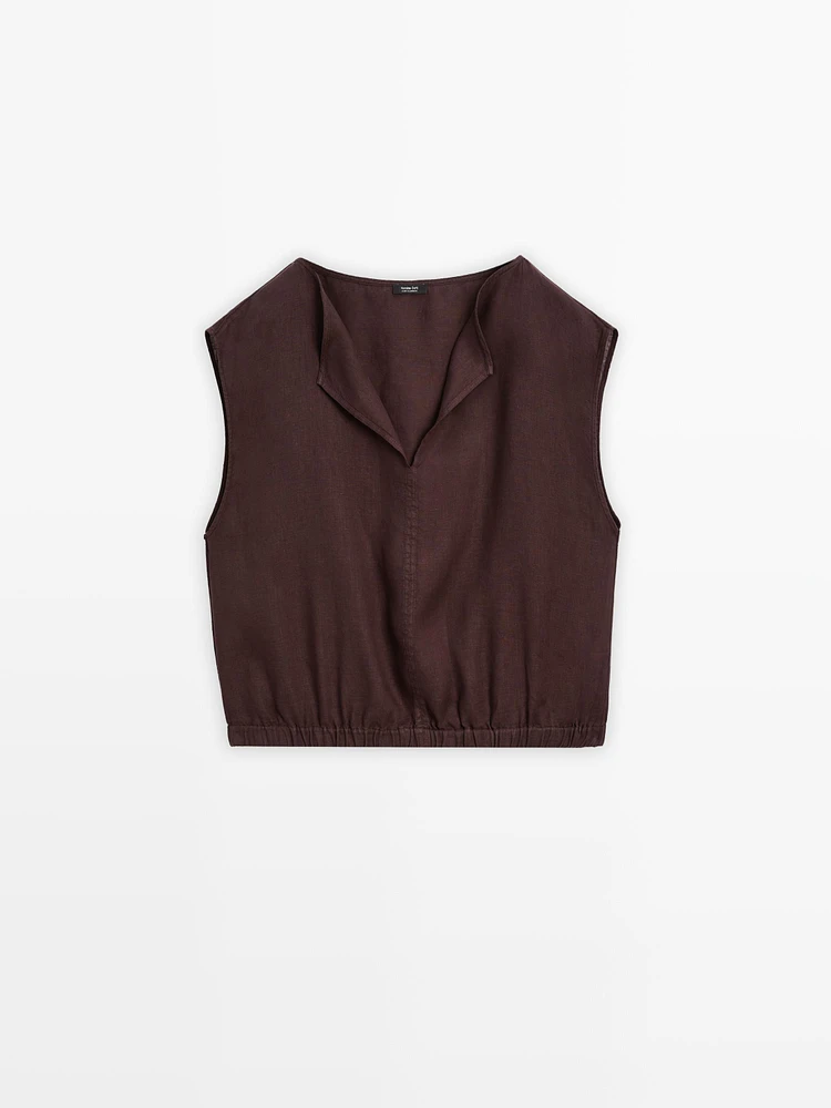 Linen blouse with elasticated hem