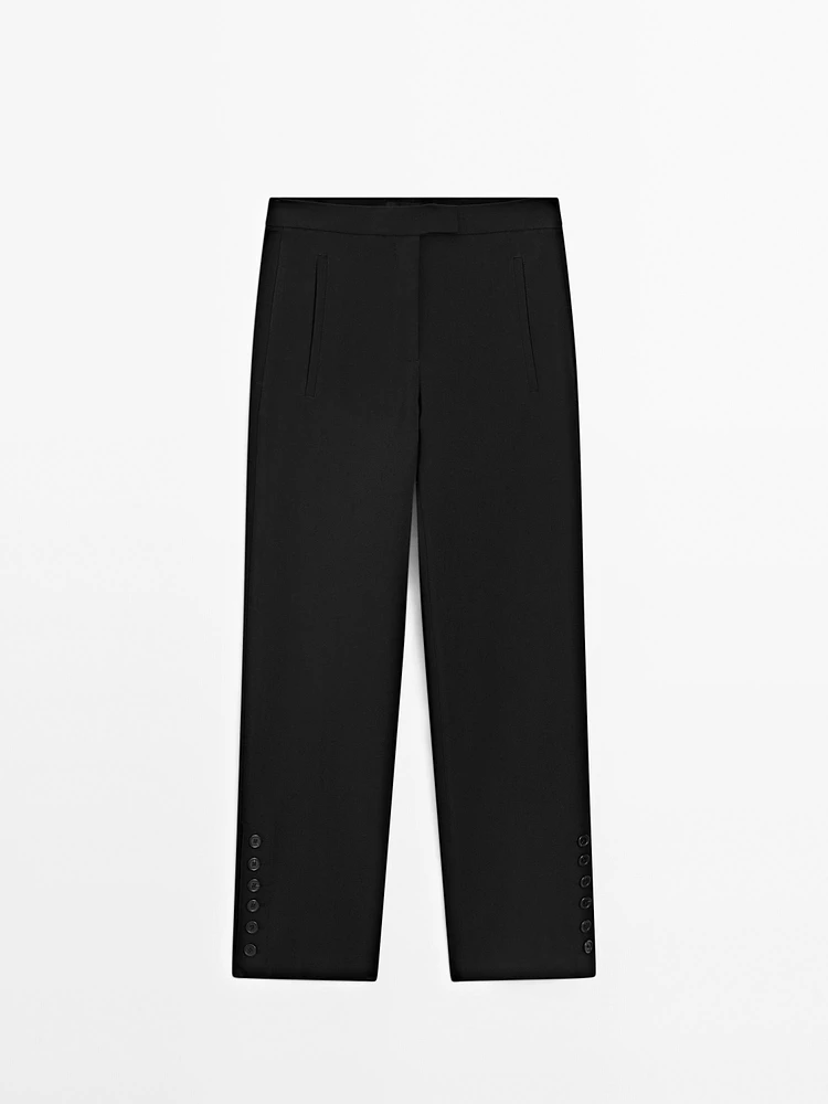Pantalon avec boutons dans le bas