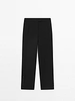 Pantalon avec boutons dans le bas