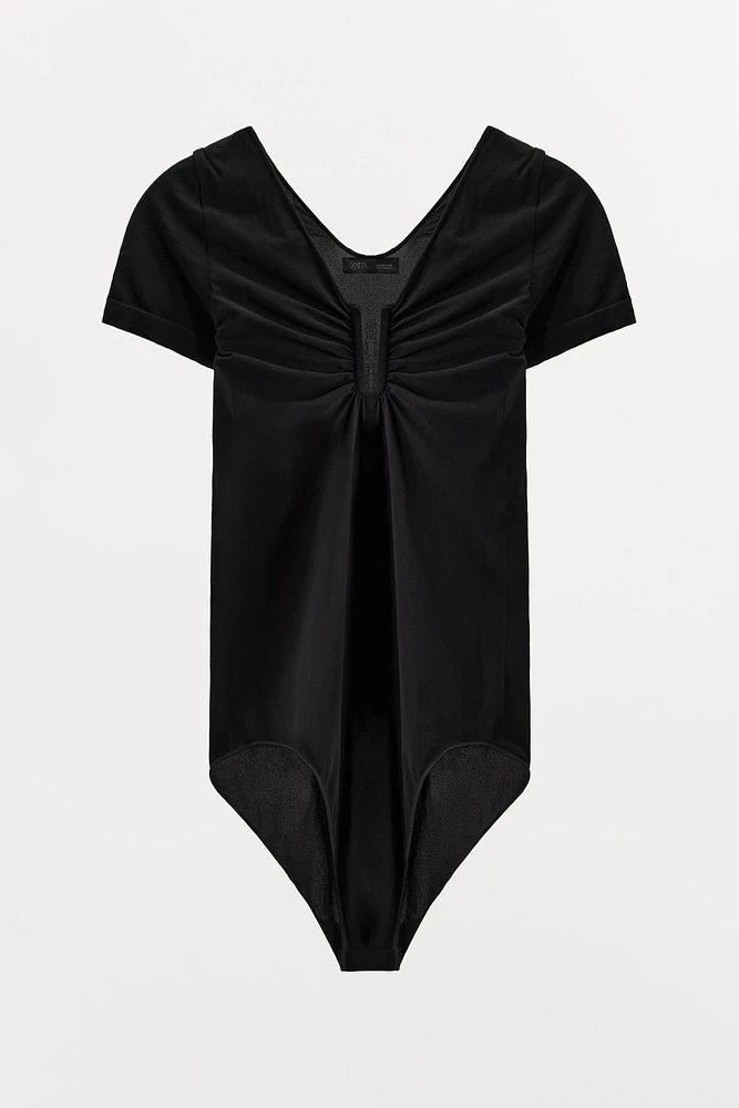 STOCKING BODYSUIT WITH METAL APPLIQUÉ