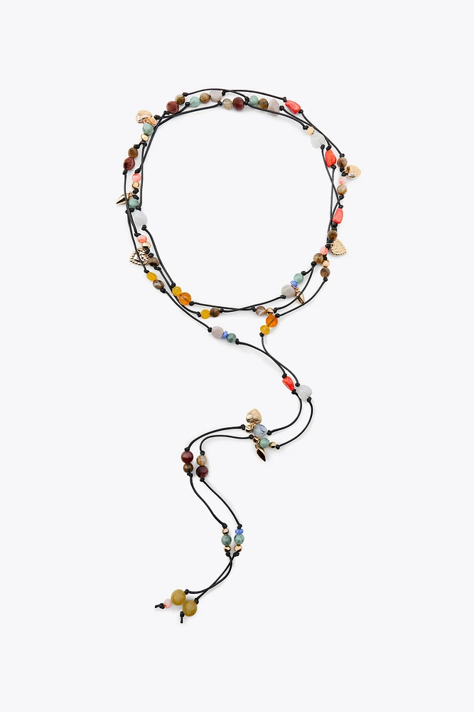 MULTI-POSITION BEADED CORD NECKLACE