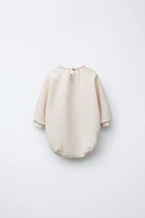FLOCKED PRINT PLUSH BODYSUIT