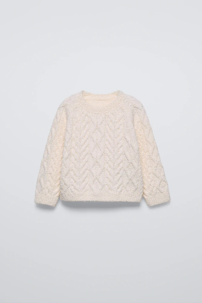 PULL EN MAILLE À TORSADES