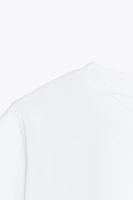 T-SHIRT SANS MANCHES EFFET DÉLAVÉ