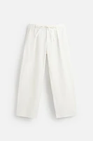 RELAXED FIT PLEATED PANTS
