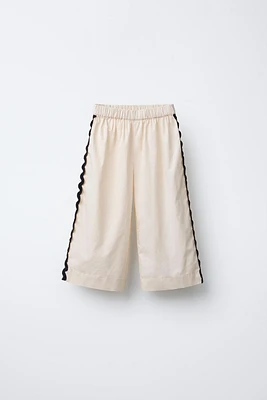 PANTALON À VAGUES LATÉRALES