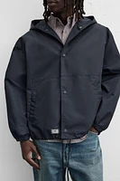 BLOUSON TECHNIQUE À CAPUCHE