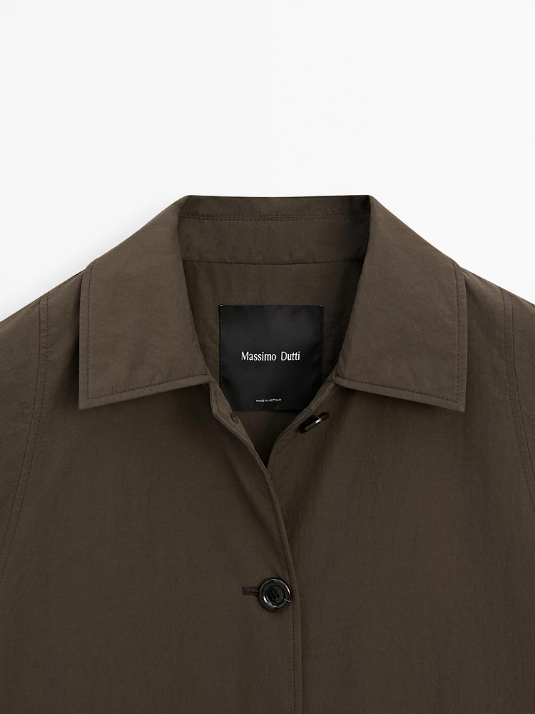 Technical fabric trench coat with button detail