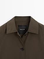Technical fabric trench coat with button detail