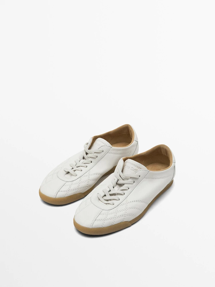 White topstitched trainers