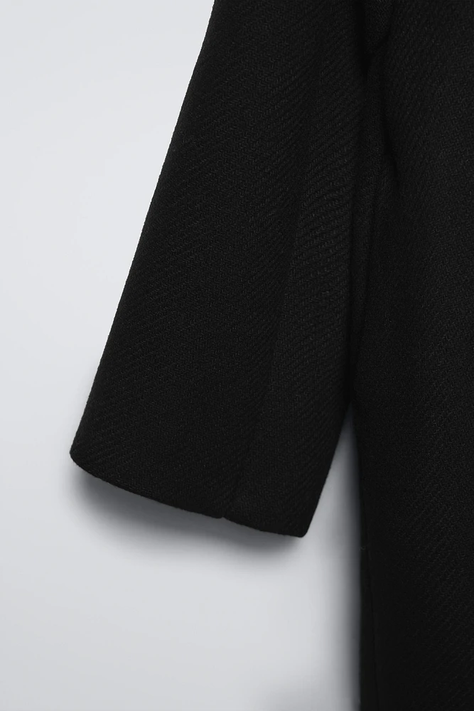 MANTEAU CONTENANT DE LA LAINE