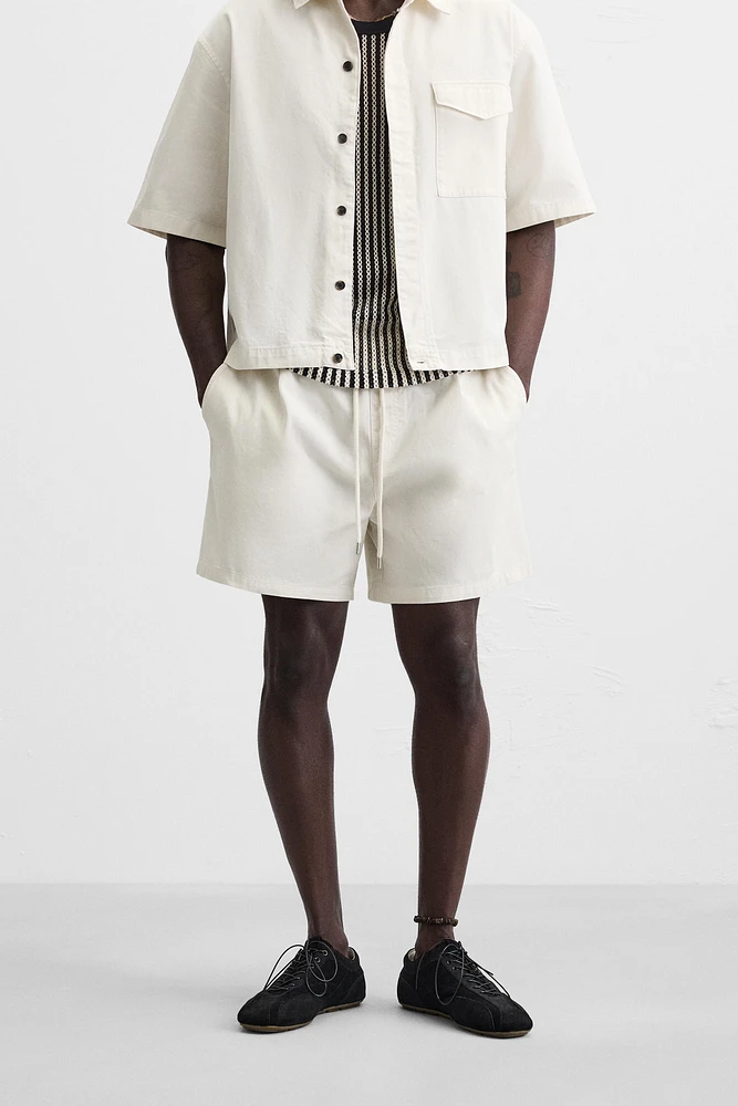 BERMUDA RELAXED FIT DÉLAVÉ
