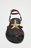 FLAT SUEDE SANDALS WITH METALLIC PIECE