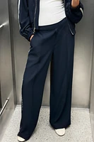 PANTALON À JAMBES LARGES ET BANDE LATÉRALE