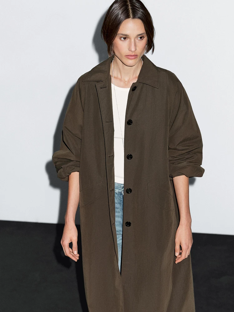 Technical fabric trench coat with button detail