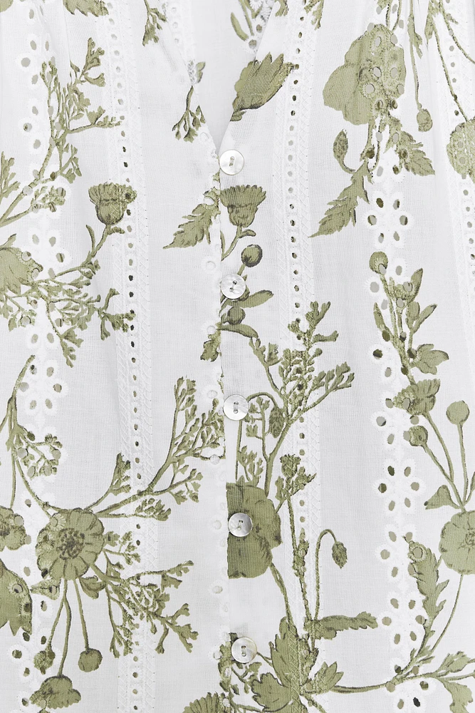 PRINTED TOP WITH EMBROIDERED EYELETS