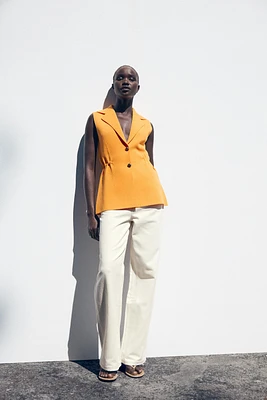 RUFFLED WAIST VEST TOP