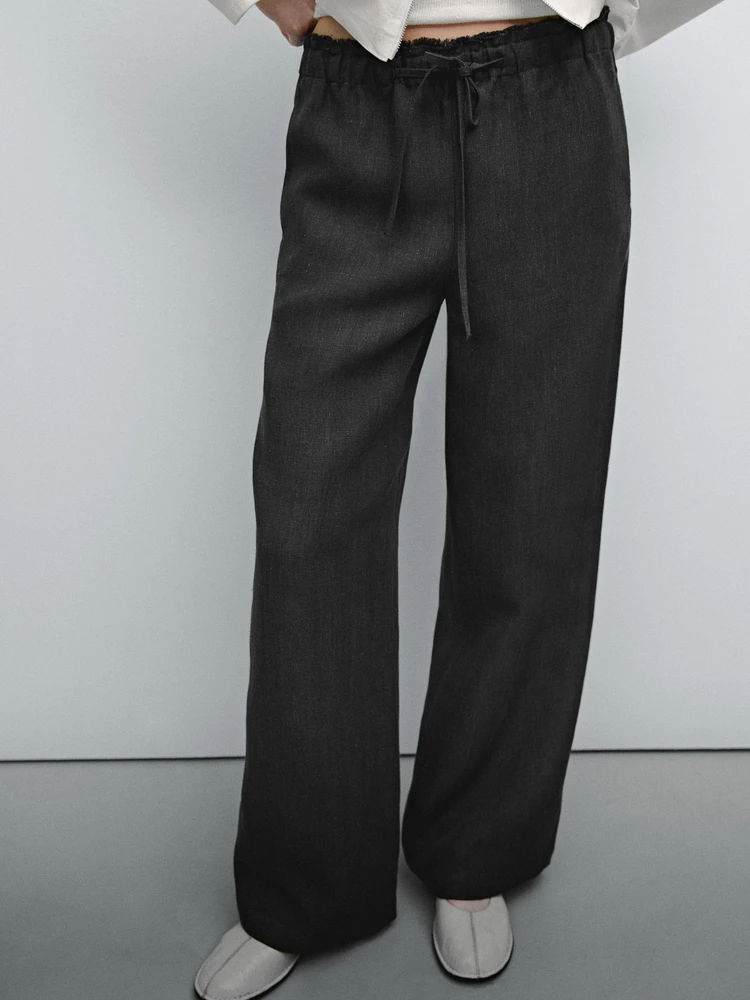 Linen suit trousers with frayed detail
