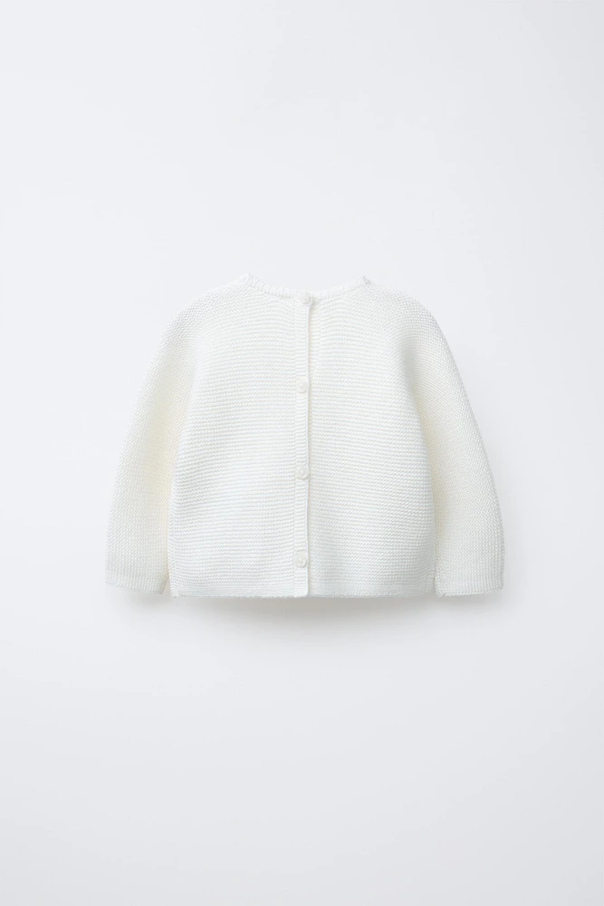 PULL EN MAILLE AVEC POCHE